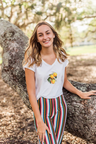 girl by tree in riverside park Riverside Park Senior Portraits