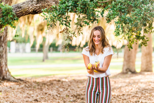 girl tossing lemons in riverside park