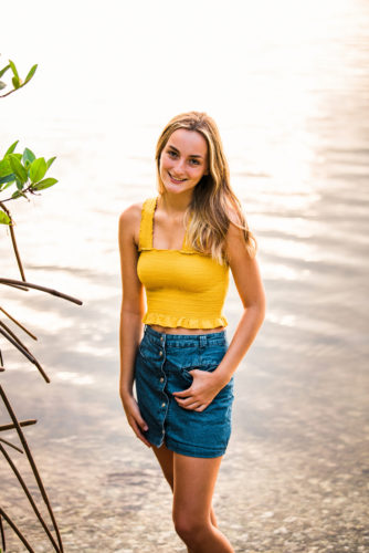 girl in yellow top by mangroves
