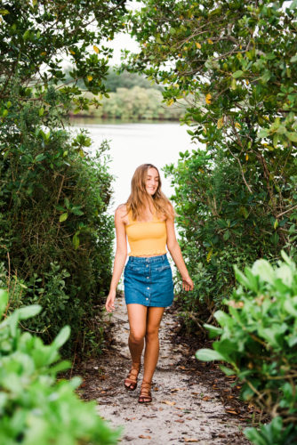 girl in yellow top by river