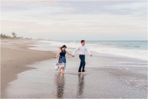 couple holding hands on beach at Ocean Ave Best Engagement Session Beach Locations