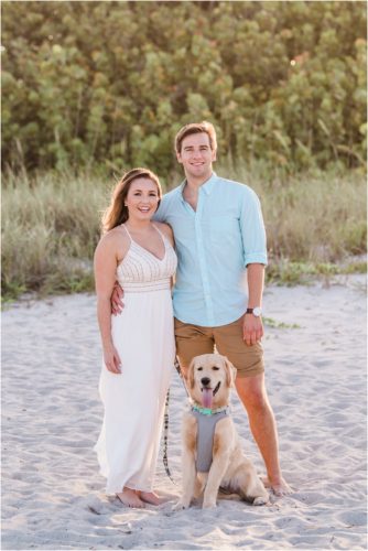 Couple with dog on beach