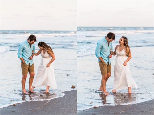 couple playing by water