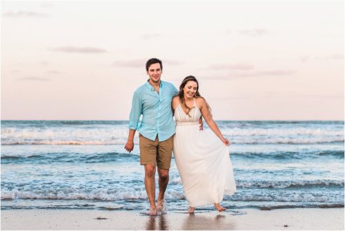 Couple walking and laughing Cocoa Beach Engagement