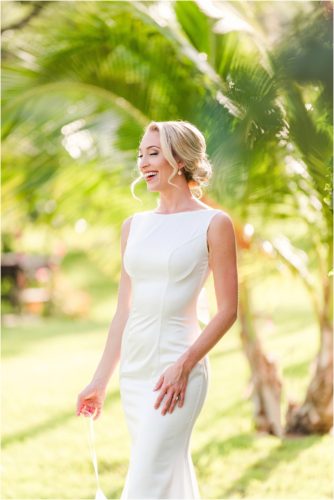 Bride laughing with sun glowing during Melbourne Beach vow renewal inspired shoot