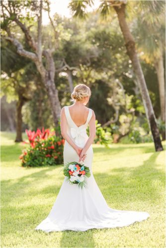 Back of dress and tropical bouquet during Melbourne Beach vow renewal inspired shoot