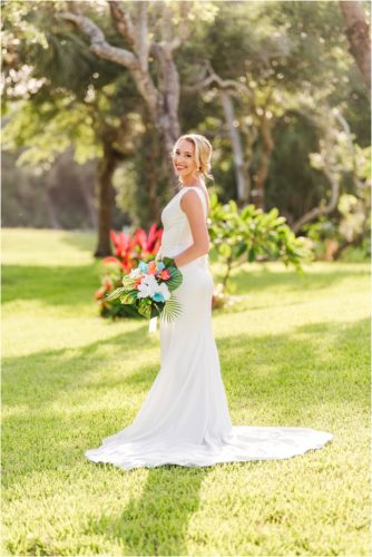 Bride with tropical bouquet during Melbourne Beach vow renewal inspired shoot