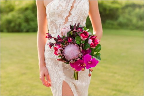 Bride holding bright pink bouquet during Melbourne Beach vow renewal inspired shoot