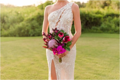 Bride with pink bouquet on golf course during Melbourne Beach vow renewal inspired shoot