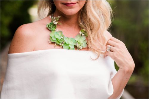 bride with succulent necklace in tunnel of trees during Melbourne Beach vow renewal inspired shoot