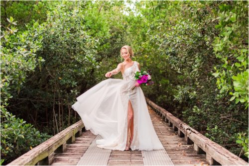 Bride twirling dress on boardwalk during Melbourne Beach vow renewal inspired shoot