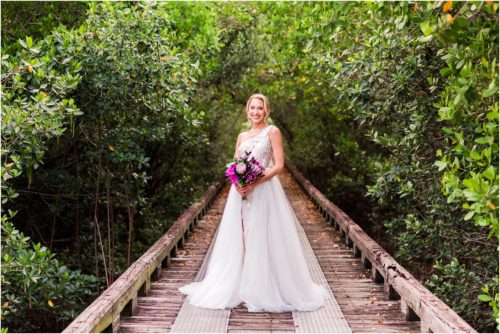 Bride on boardwalk during Melbourne Beach vow renewal inspired shoot