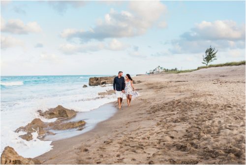 Couple walking down the beach House of Refuge Engagement session