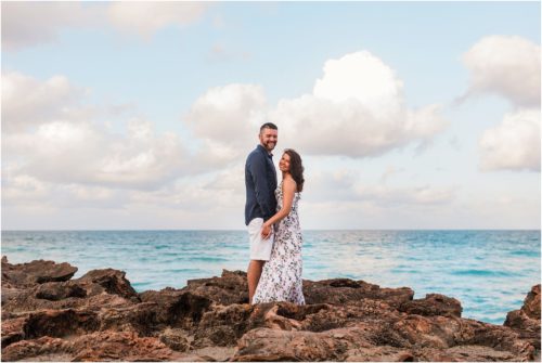 Couple standing on rocks House of Refuge Engagement session