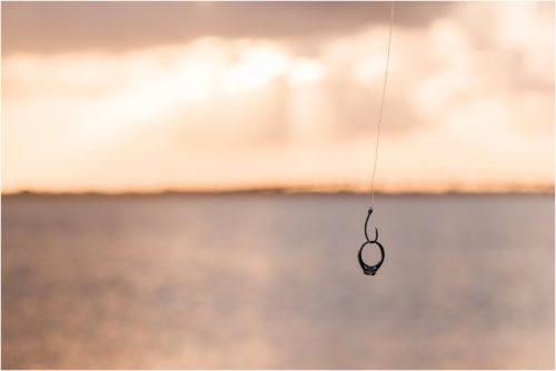 engagement ring on hook with sunset in background House of Refuge Engagement session