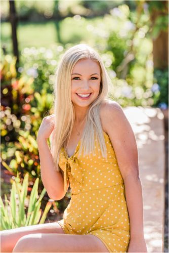 Girl laughing in yellow romper