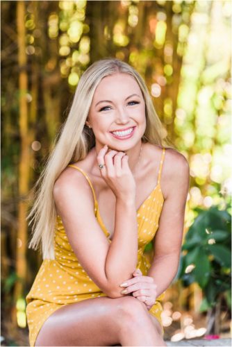Girl with blond hair sitting on bench at Rockledge Gardens