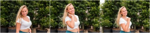 Senior in front of green plants during senior portrait session