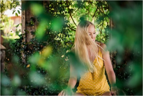 Girl with hair blowing in her face Rockledge Gardens Senior Pictures