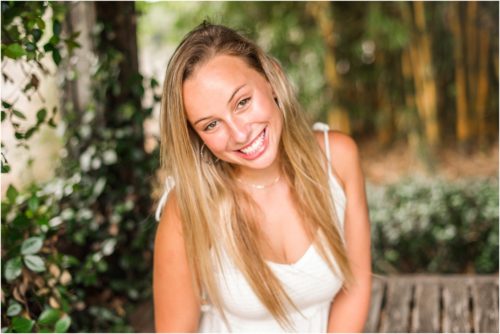Sitting in white dress sitting on bench Senior Photography at Rockledge Gardens