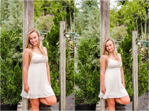 Senior in white dress leaning on a pole at Rockledge Gardens