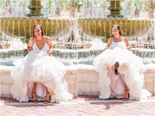 Bride sitting on edge of fountain lifting her Haley Paige wedding dress up. Melbourne Florida Wedding Photographer