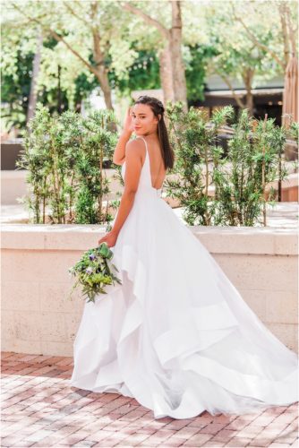 Bride showing back of wedding dress Melbourne Florida Wedding Photographer