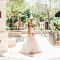 Bride holding flowers from Fern and Curl at the Fountain in Viera Melbourne Florida Wedding Photographer