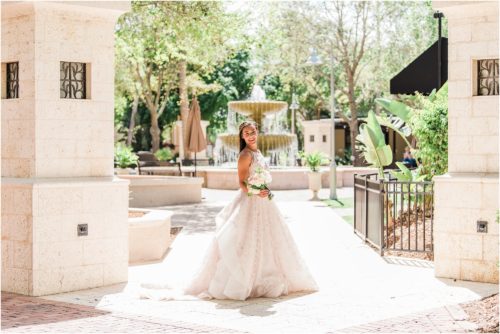 Bride holding flowers from Fern and Curl at the Fountain in Viera Melbourne Florida Wedding Photographer