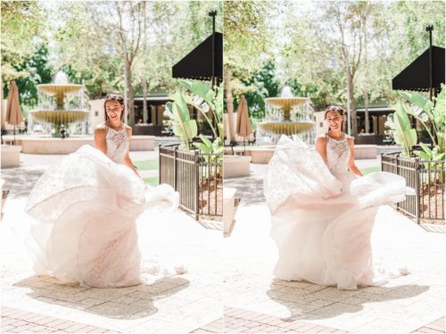 Bride twirling a Haley Paige Gown in Viera by fountain Melbourne Florida Wedding Photographer