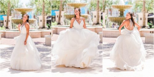 Bride laughing by fountain in Viera