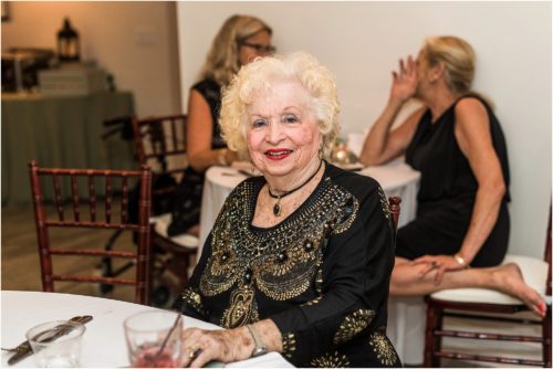 Grandmother sitting at table at Harbour House wedding Grandparents in your wedding photography