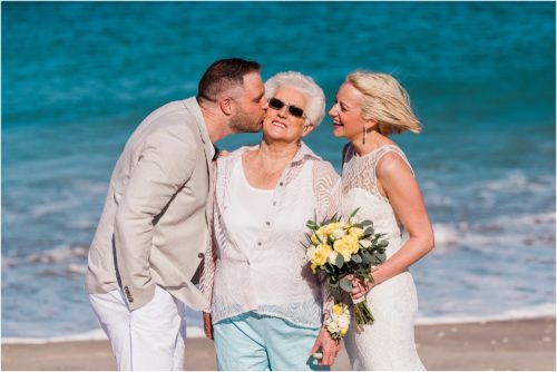 Bride and groom and grandmother laughing on the beach Grandparents in your wedding photography