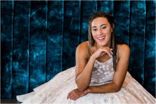 Bride sitting on blue couch Melbourne Florida Wedding
