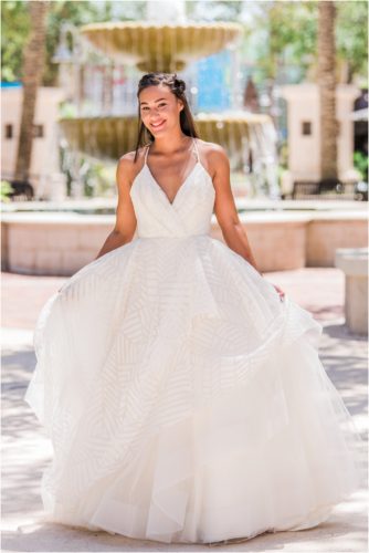 Bride with fountain in background in Haley Paige gown Melbourne Florida Wedding