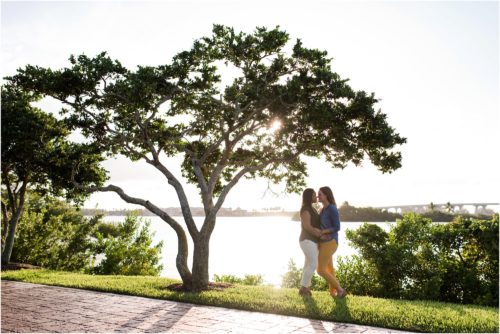 Couple hugging under tree Vero Beach Engagement Photographer