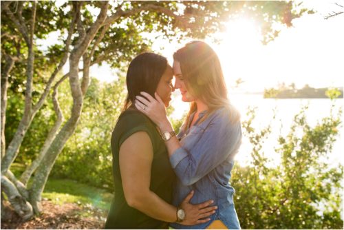 Couple hugging with setting sun