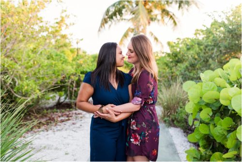 Same sex couple hugging on path Vero Beach Engagement Photographer