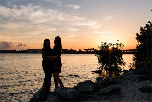 Same sex couple with sun setting at Riverside Park Vero Beach