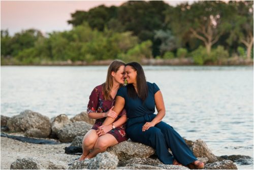 Couple sitting on rocks at Riverside Park Vero Beach Engagement Photographer