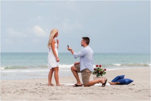 Man down on one knee asking girl to marry him after Surprise Proposal on Cocoa Beach