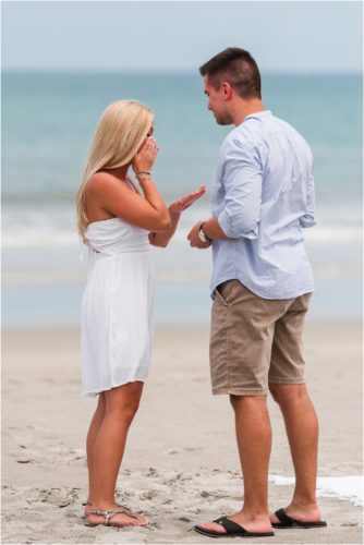 Girl looking at her engagement ring after a Surprise Proposal