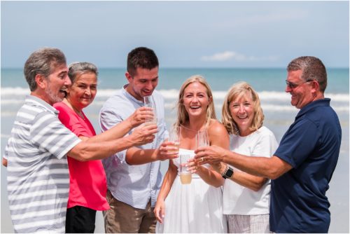 Group cheering after Surprise Proposal on Cocoa Beach