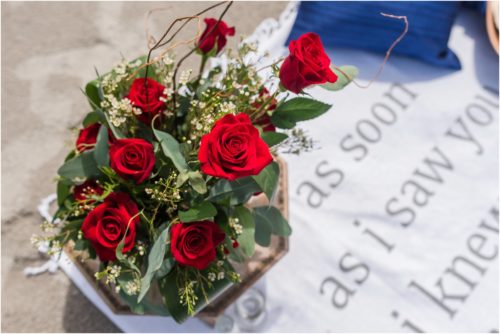 Red roses from Fern and Curl Design on beach blanket