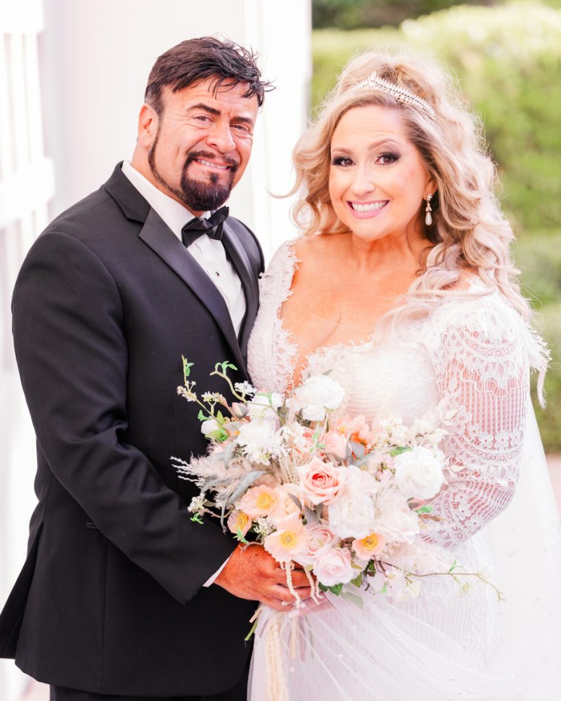 Bride and groom posing together on their Florida wedding day at Costa D'este in Vero Beach