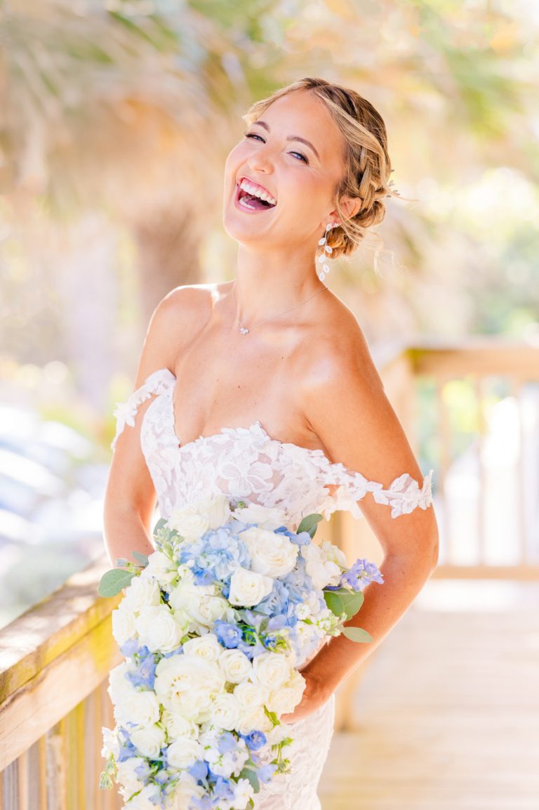 bride laughing at Harbour House Oceanfront venue on deck