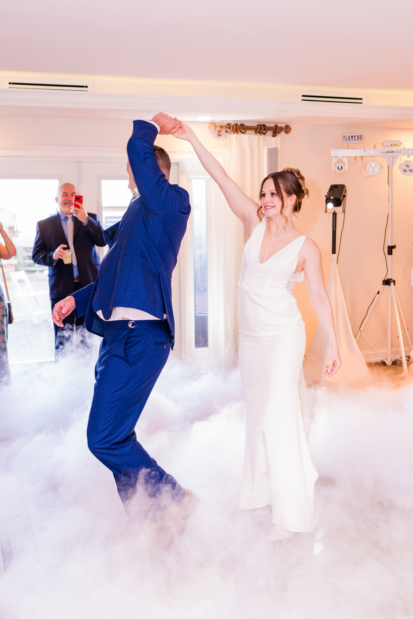 Bride twirling the groom during their first dance at Harbour House Oceanfront.