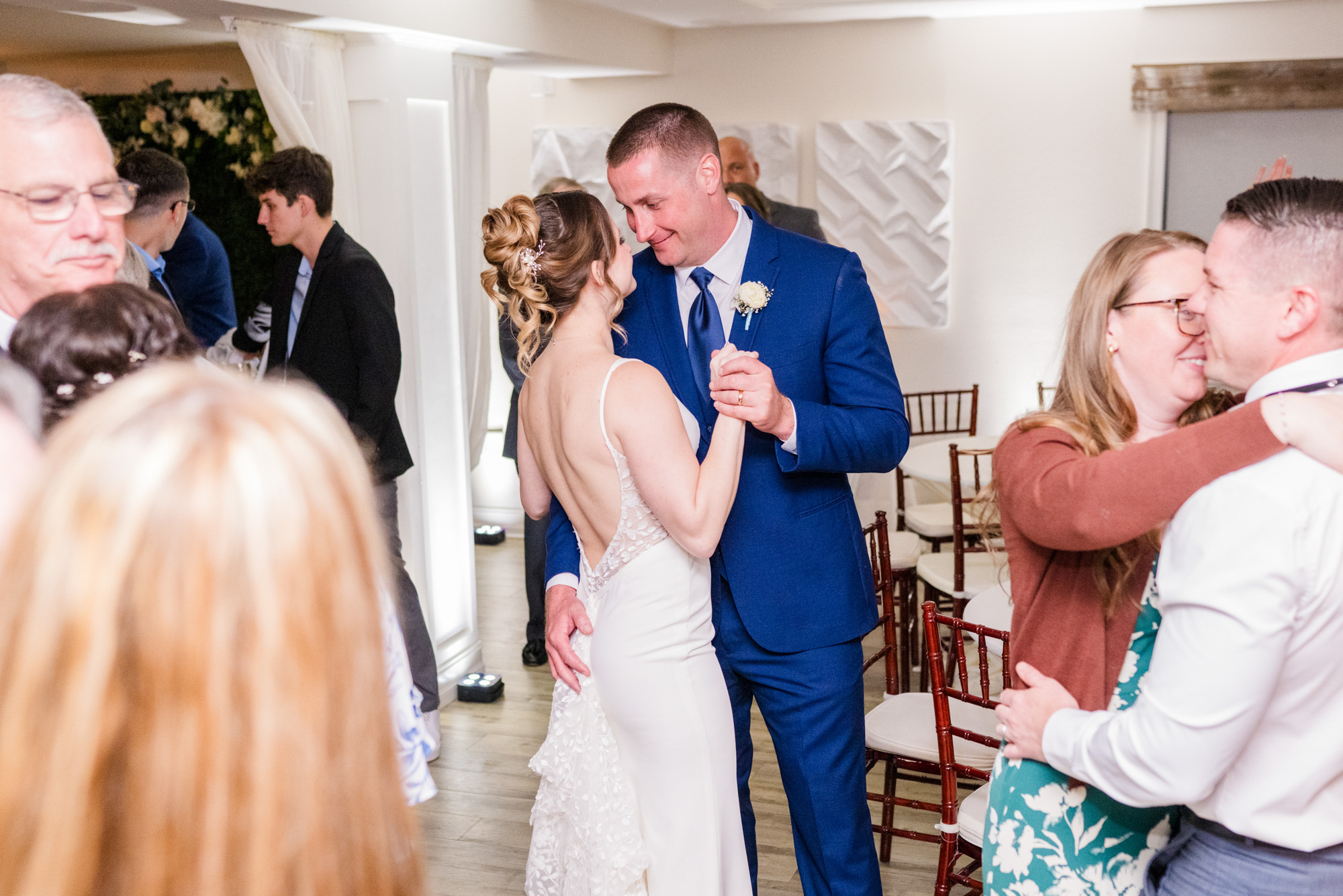 Bride and groom slow dancing together during their wedding reception.