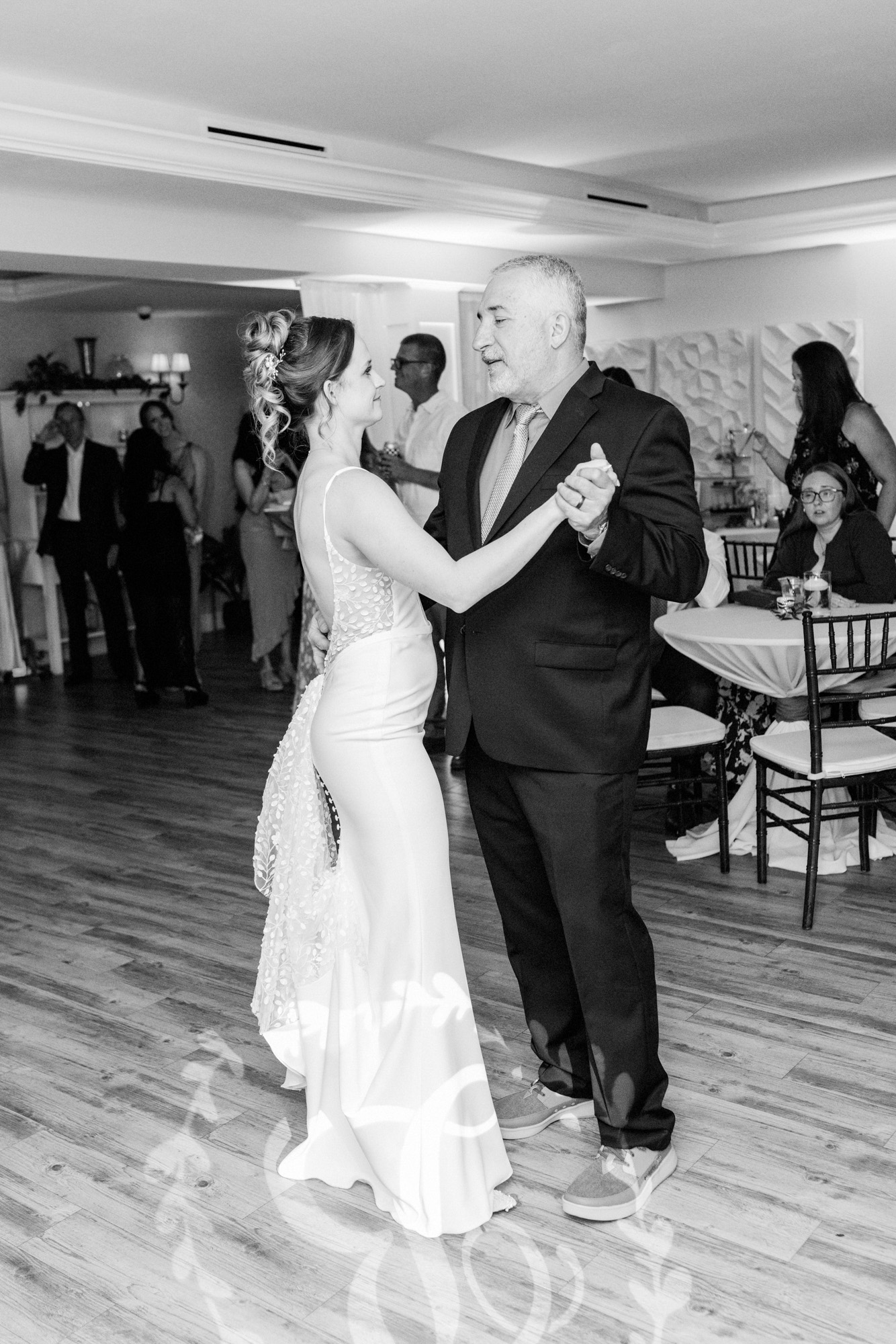 Bride dancing with her dad at her wedding.