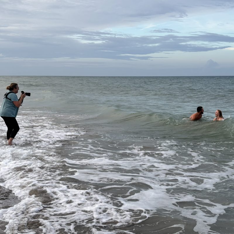 behind the scenes of Liz Cowie Photography photographing an engagement session in the water